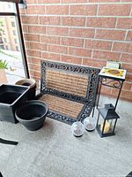 Group shot showing mats, planters, stand, solar lights and lantern