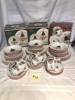 Full set displayed with three original boxes and stacked pieces