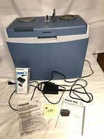 Cooler front with adapter, cords, manuals