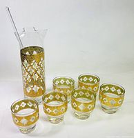 Full set showing pitcher, stirrer and six glasses