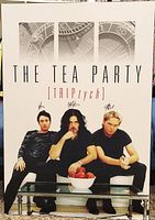 Front view of plaque-mounted Triptych poster showing full artwork and signatures