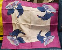 Full view of square silk scarf showing goose motif and border