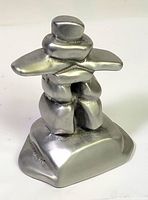 Front view of cast aluminum Inukshuk sculpture
