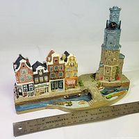 Front view showing assembled canal base with four buildings and tower, ruler for scale