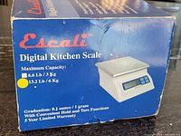 Retail box showing Escali branding and capacity details