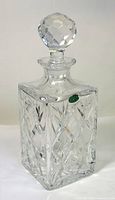 Full view of square cut crystal decanter with stopper in place