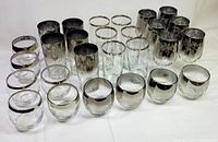 All 27 pieces arranged showing variety of sizes and finishes