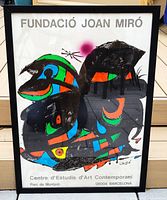 Front view of framed Fundació Joan Miró opening poster showing full artwork and text