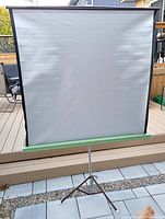 Front view of assembled projection screen on tripod