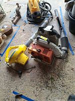 Stihl BR400 backpack blower and yellow Weedeater blower on garage floor