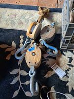 All three wooden block pulleys showing hooks and sheaves