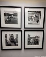 All four framed photographs on wall