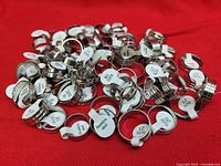 Pile of stainless steel rings showing quantity and size tags