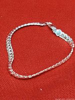 Full view of bracelet on red fabric