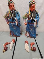 Front view showing both figurines and loose accessory pieces