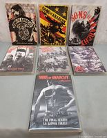 Front view of all seven Sons Of Anarchy season DVD cases