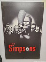 Full view of mounted Simpsons Sopranos parody poster