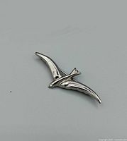 Front view of single sterling silver swallow brooch