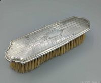 Top view showing silver lid design and cartouche