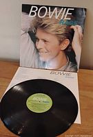 Front jacket showing Bowie portrait and vinyl record with label