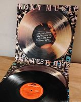 Front cover and vinyl showing side one label