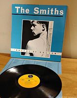 Front cover showing title and sleeve art with vinyl displayed