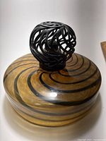 Overall view of amber swirl fragrance lamp with decorative crown