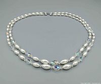 Full view of necklace closed, showing bead design and clasp