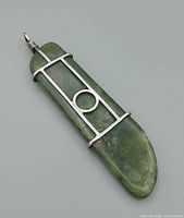 Front view showing full pendant, jade stone, silver framework, bail