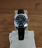 Front view of Timex wristwatch on stand