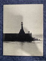 Front cover showing lighthouse silhouette