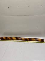 Full view of bamboo staff with tape measure showing overall length near 36 in