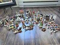 Wide shot showing entire assortment of Christmas village pieces