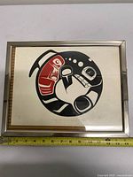 Full view of framed print with measuring tape showing size