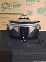 Front view of Crock-Pot base with digital panel and power cord attached
