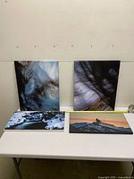 All four canvas prints on table