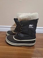 Side profile of both boots showing overall condition and Sorel logo