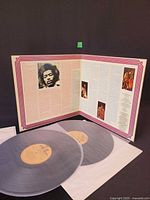 Gatefold open showing inner sleeve text, two records removed