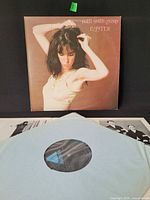 Front jacket of Patti Smith Group Easter with inner sleeve and record partially visible