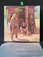 Front jacket showing album art and band