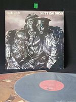 Front jacket featuring bronze soldier statue artwork