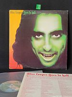 Front jacket showing album artwork and partial vinyl with inner sleeve