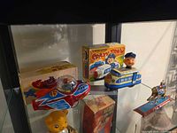 Space Jet rocket, Crazy Train trolley and their boxes on shelf