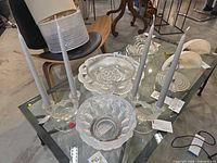 Overview showing crystal bowl on silver base and the pair of double candlestick holders