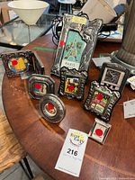 All eight silver frames displayed on tabletop