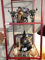 Overall view showing vase, candle holders, bronze figure and lotus holders