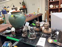 Overall lot showing frog vase, bronze figurines and ashtray