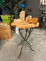 Full view of live-edge table with metal base and all decor items displayed