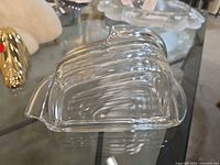 Butter dish side view showing ribbed dome and base handle