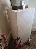 stone pedestal angled view